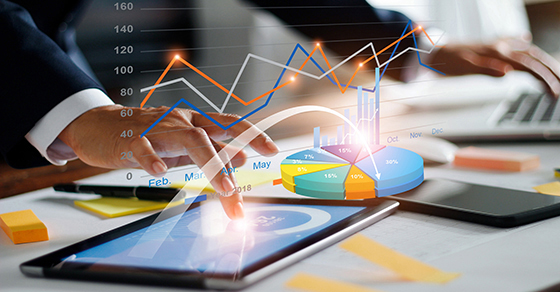 Businessman using tablet and laptop analyzing sales data and economic growth graph chart. Business strategy. Digital marketing. Business innovation technology concept (Demo) - KSDT CPA