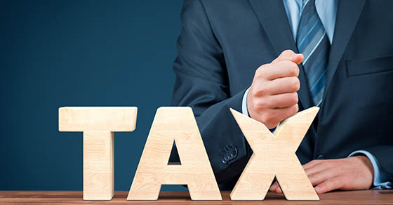 TaxReductionBusinessAndFinancialConceptAngryBusinessmanTryTo
